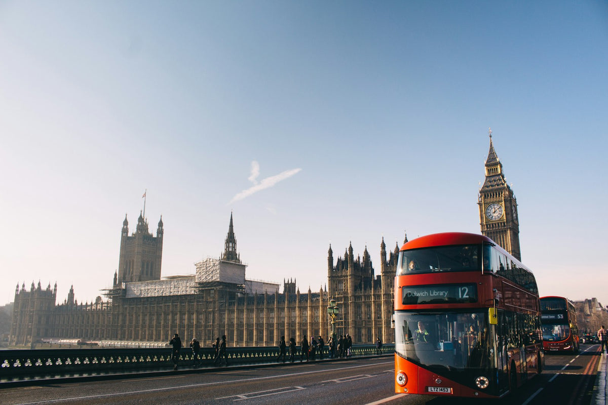Red bus passing Westminster