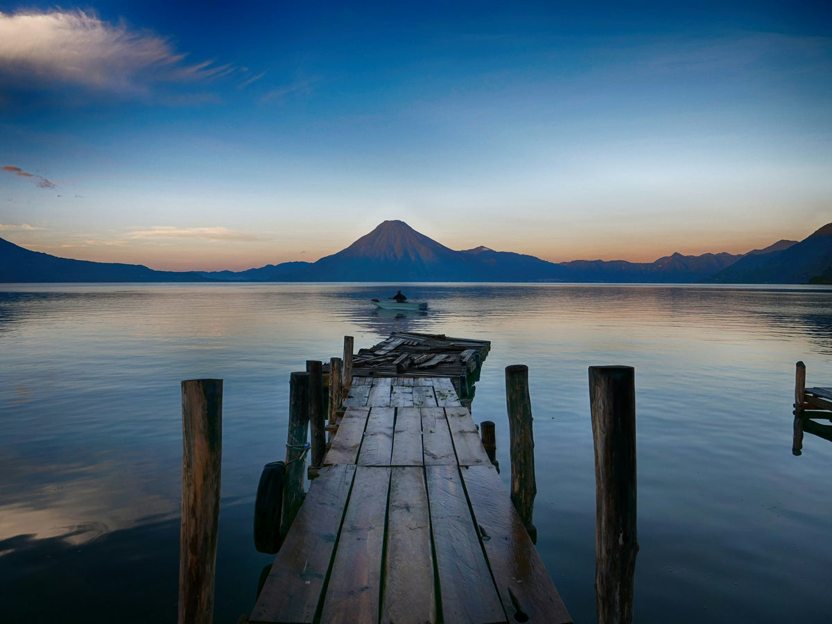 Dock on Lake Atitlan with a volcano, Guatemala