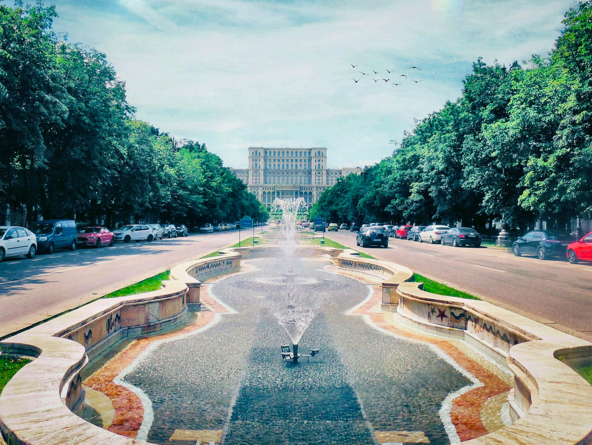 Fountains on Unirii Boulevard with the Palace of the Parliament, Bucharest